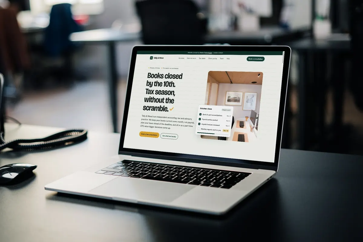 An accounting firm website concept open on a MacBook in an office